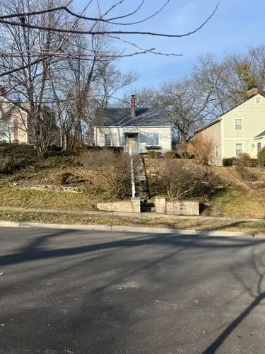 Steps to a cozy home on a sunny winter hill.